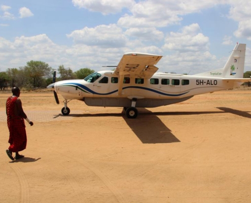 A Cessna Grand Caravan Turboprop on an unpaved landing stip in Tanzania